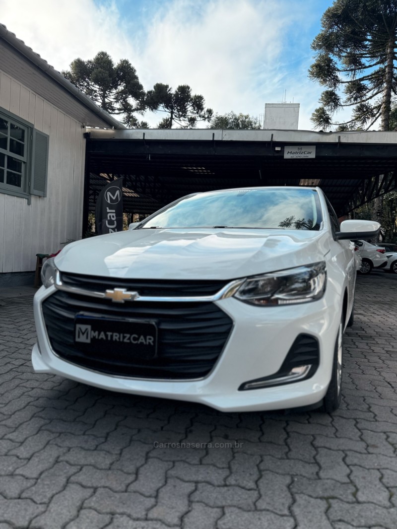 onix 1.0 premier 12v turbo flex 4p automatico 2021 canela