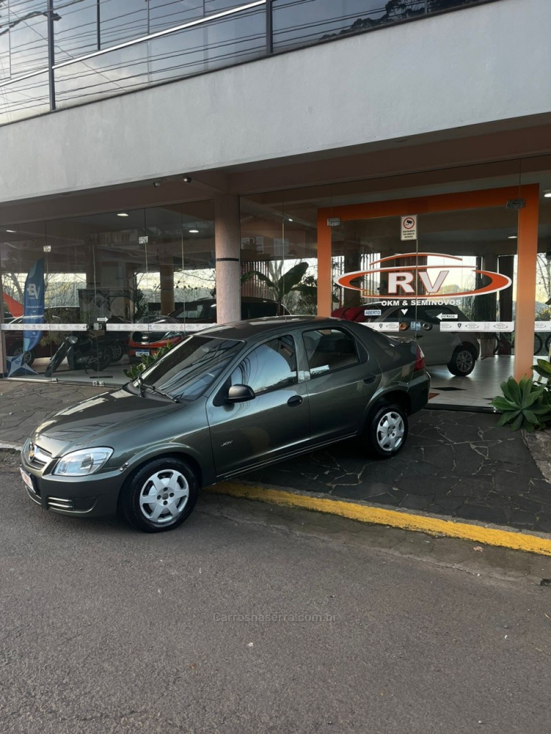 PRISMA 1.0 MPFI JOY 8V FLEX 4P MANUAL - 2010 - CARLOS BARBOSA