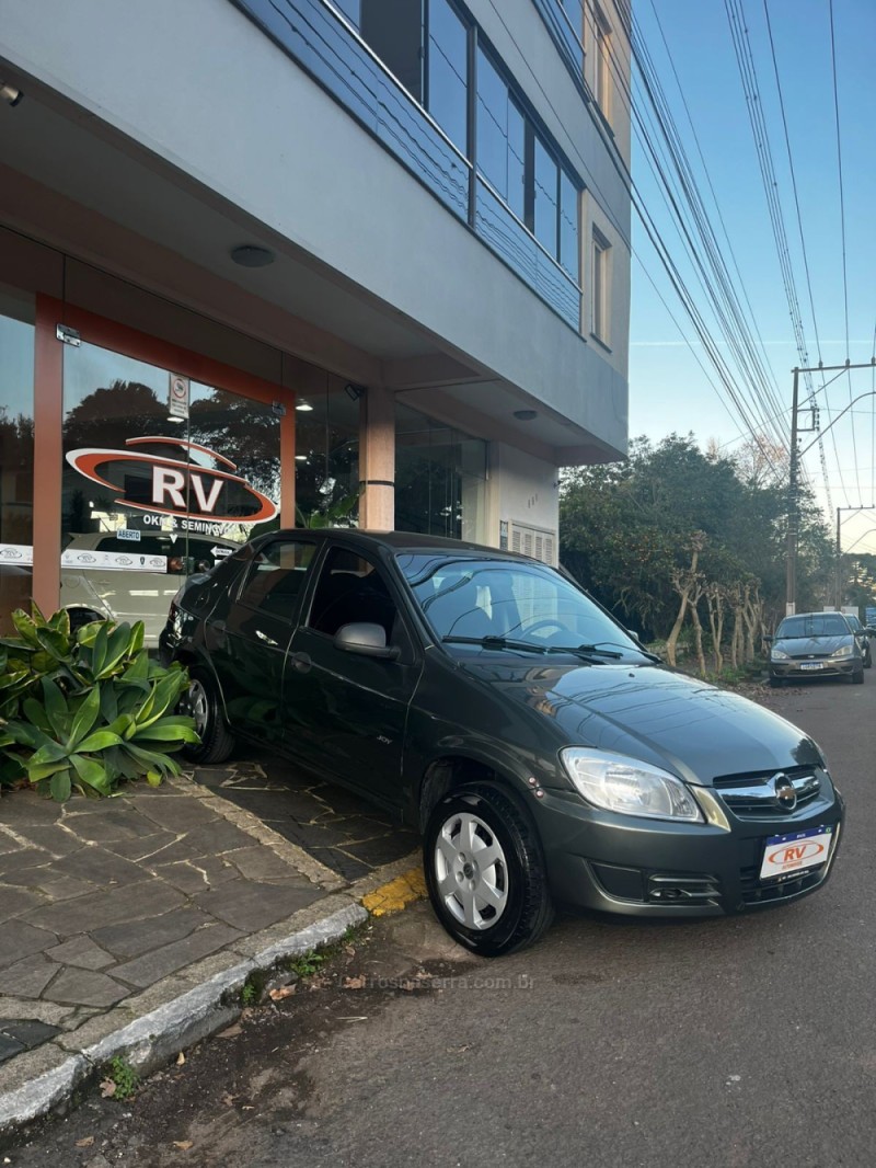 PRISMA 1.0 MPFI JOY 8V FLEX 4P MANUAL - 2010 - CARLOS BARBOSA
