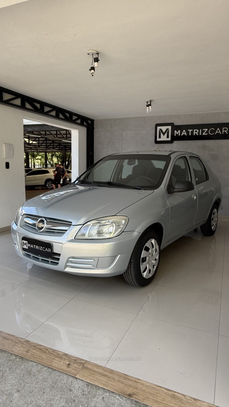 PRISMA 1.0 MPFI VHCE MAXX 8V FLEX 4P MANUAL - 2010 - CANELA