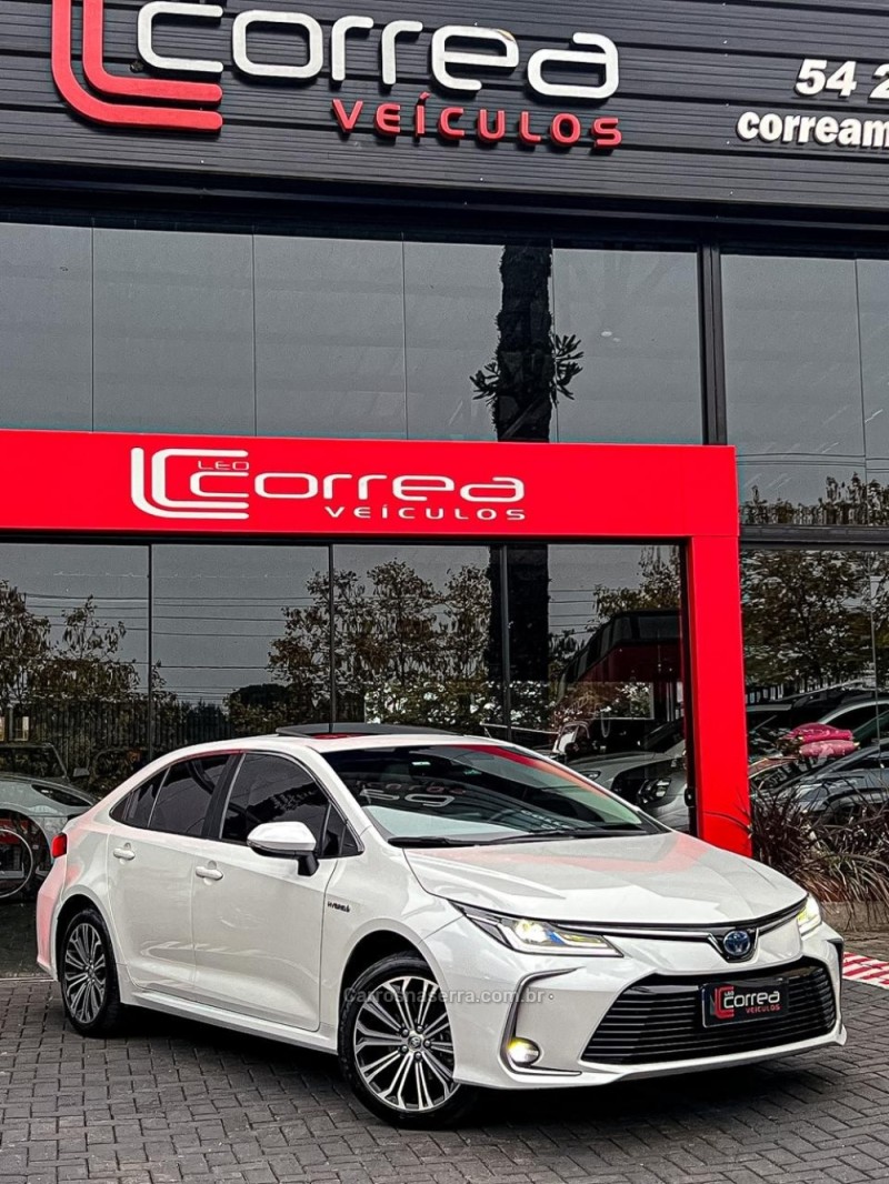 corolla 1.8 altis premium 16v hibrido 4p automatico 2023 canela