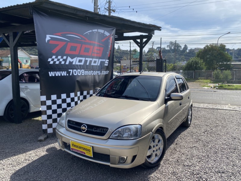 Chevrolet Corsa Hatch 1.4 Mpfi Maxx 8v Flex 4p Manual Dourado Flex 2012  Usado - Interior Carro