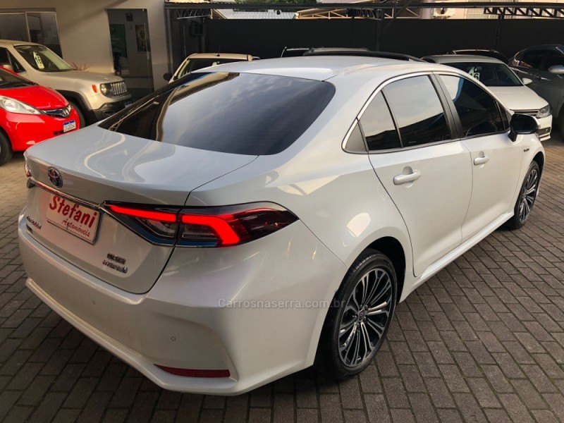 COROLLA 1.8 ALTIS PREMIUM 16V HÍBRIDO 4P AUTOMÁTICO - 2023 - FELIZ