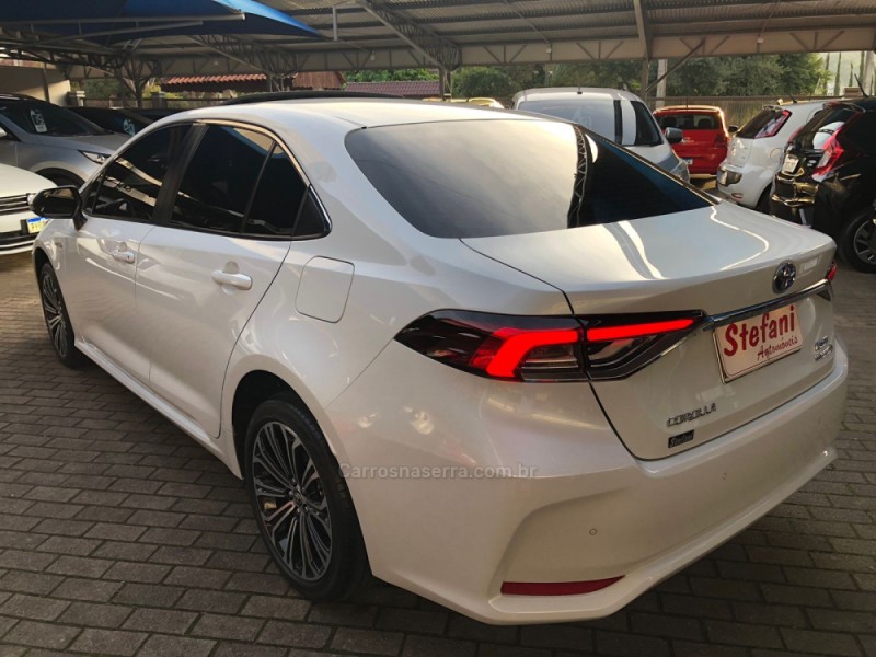 COROLLA 1.8 ALTIS PREMIUM 16V HÍBRIDO 4P AUTOMÁTICO - 2023 - FELIZ